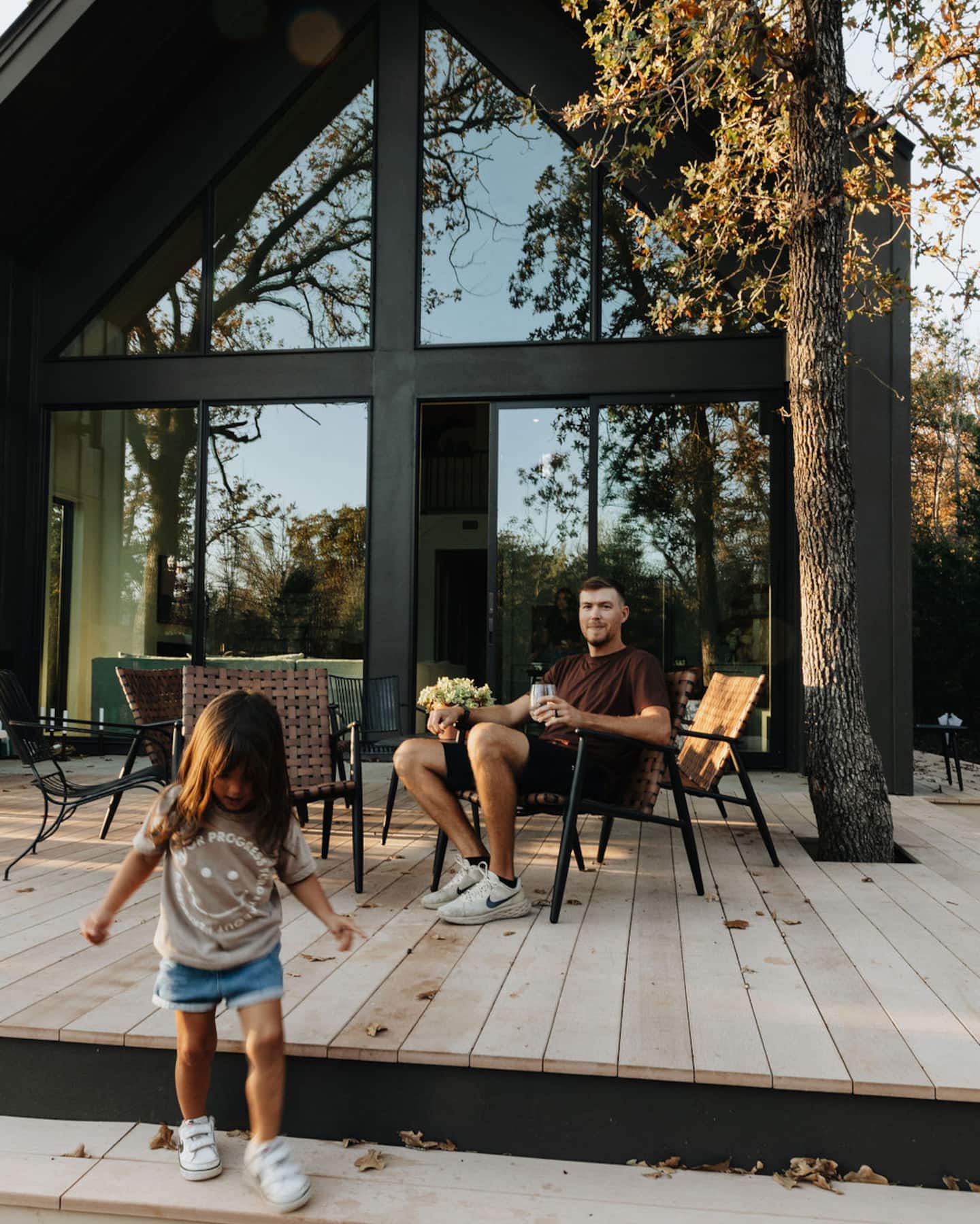 The cabin deck at golden hour, surrounded by oaks